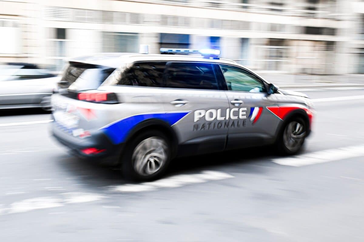 A,police,car,drives,through,the,city,ensuring,security,in