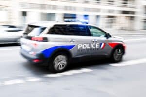 A,police,car,drives,through,the,city,ensuring,security,in